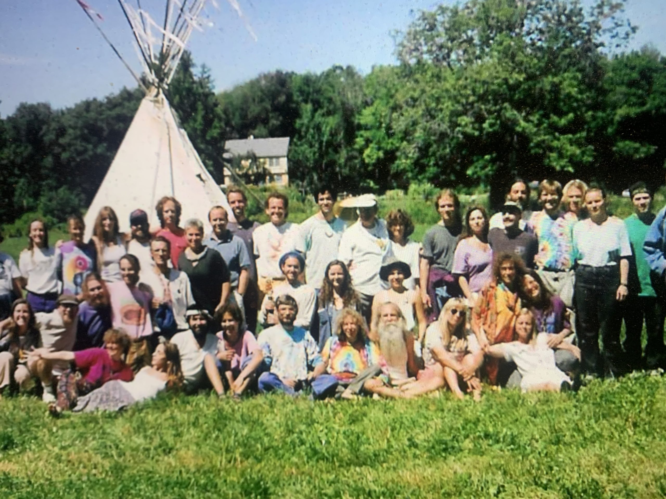 Earth Story 1993 group in front of teepee